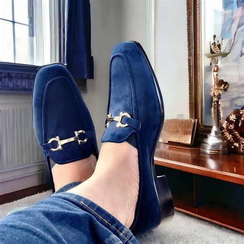 navy blue loafers with braces.